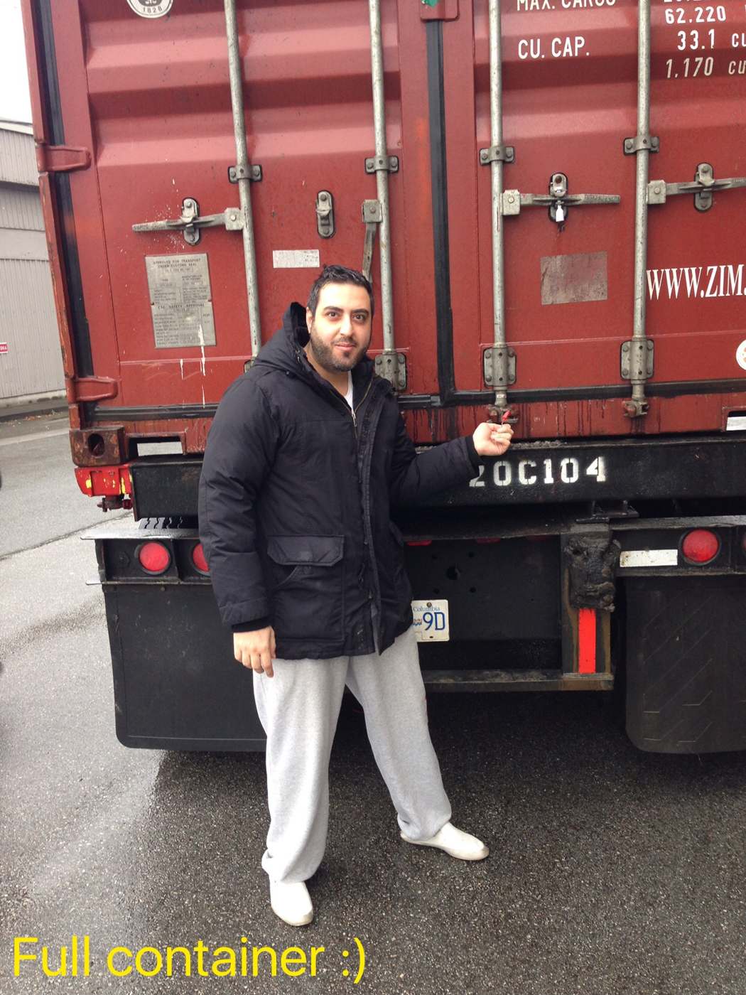 Soheil beside the first full shipping container